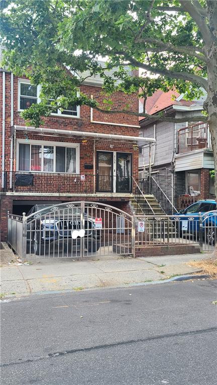 2136 84th Street Brooklyn, NY 11214 - Photo 2 of 4 front view of a house with a street