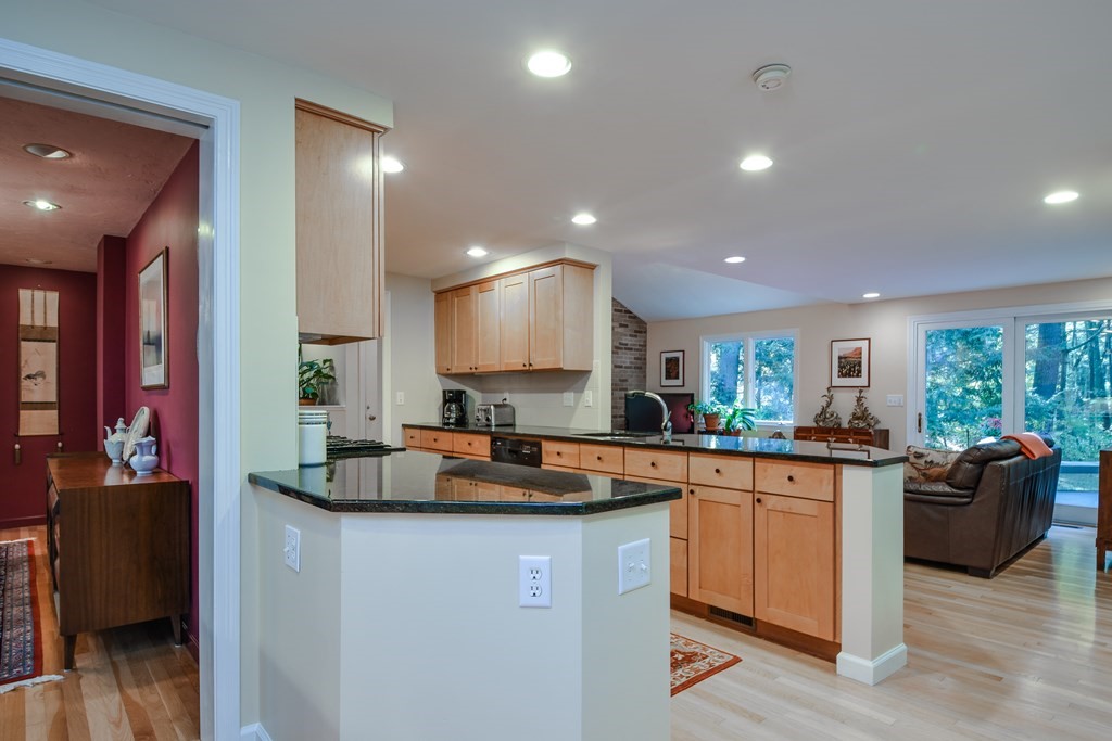 50 Old Orchard Road Sherborn, MA 01770 - Photo 12 of 26 a kitchen with a sink stove and cabinets