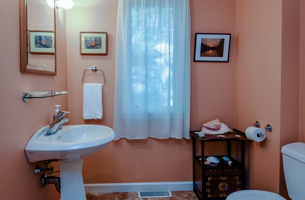 50 Old Orchard Road Sherborn, MA 01770 - Photo 18 of 26 a bathroom with a sink mirror and toilet