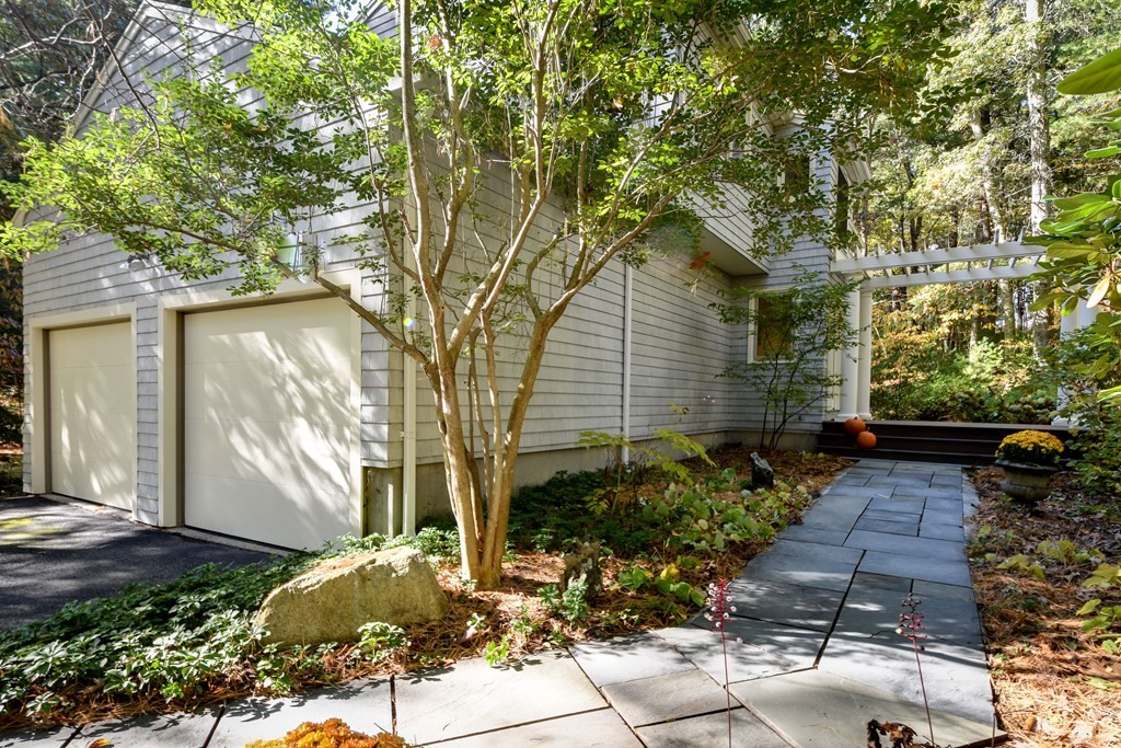 50 Old Orchard Road Sherborn, MA 01770 - Photo 2 of 26 a front view of a house with garden
