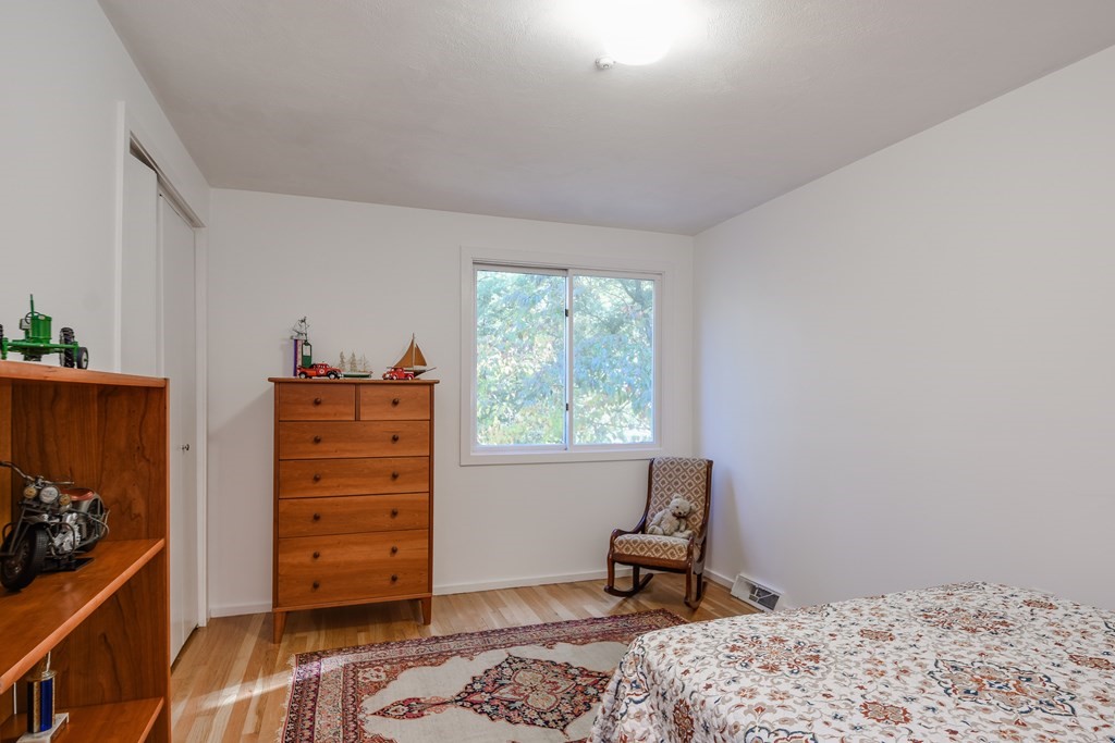 50 Old Orchard Road Sherborn, MA 01770 - Photo 23 of 26 a bedroom with a bed and a window