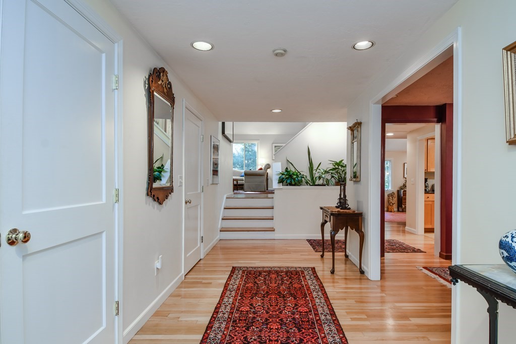 50 Old Orchard Road Sherborn, MA 01770 - Photo 5 of 26 a view of a hallway with wooden floor and dining room