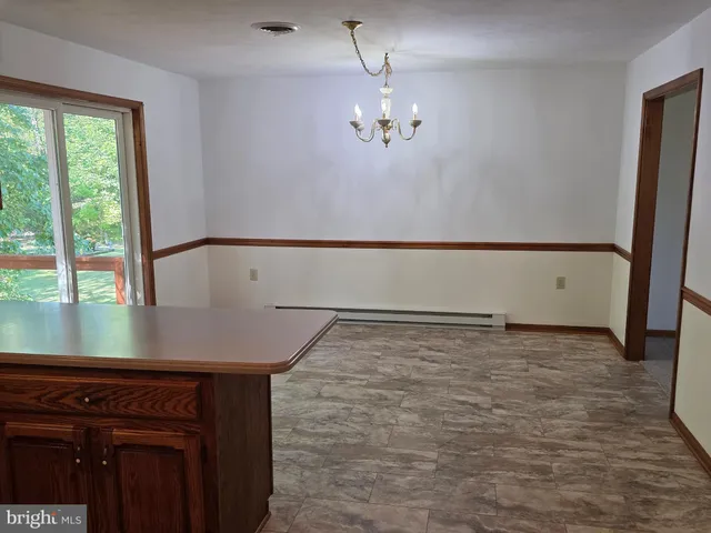 a view of a room with an entryway