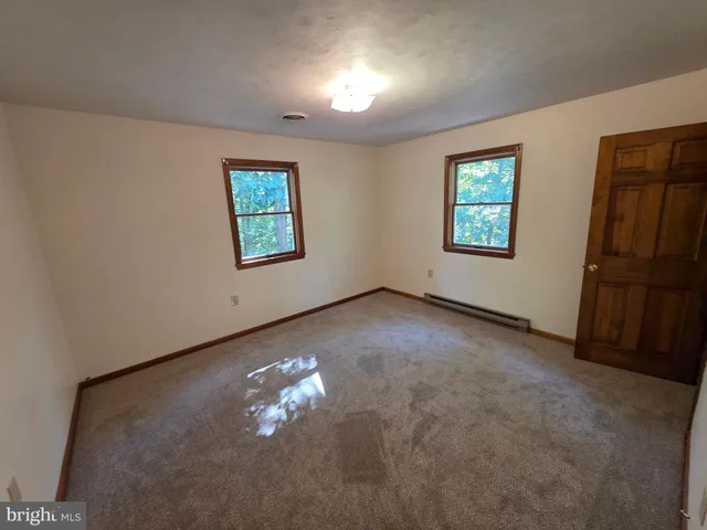 an empty room with windows