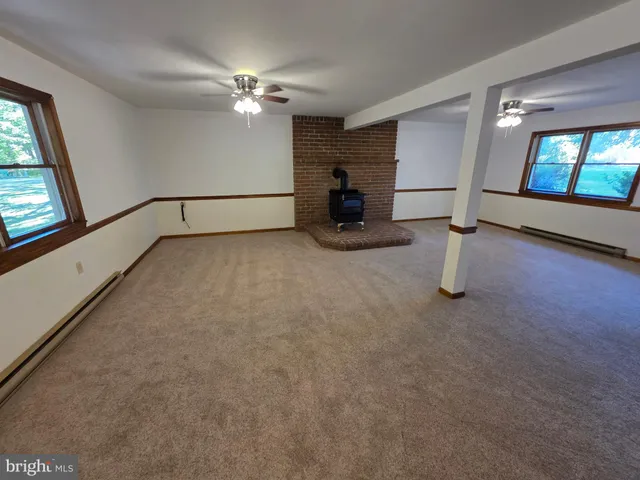 a view of an empty room with a chandelier