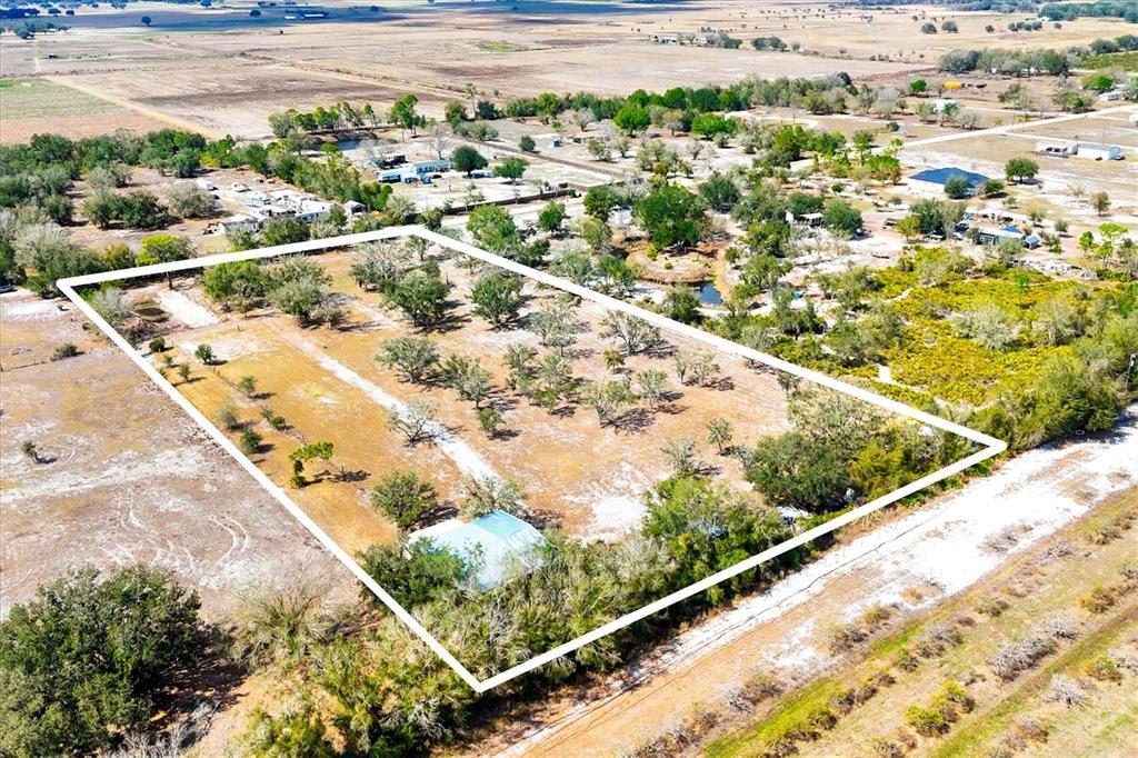 6096 Northwest Cul De Sac Road Arcadia, FL 34266 - Photo 1 of 20 a view of swimming pool from a balcony