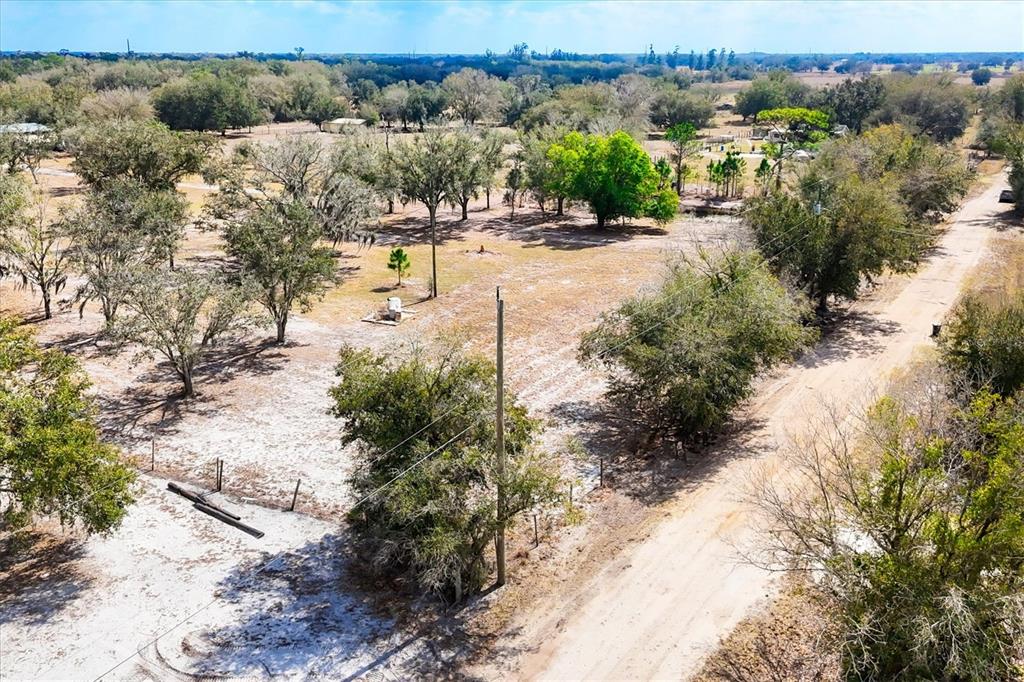 6096 Northwest Cul De Sac Road Arcadia, FL 34266 - Photo 9 of 20 a view of a yard with wooden fence
