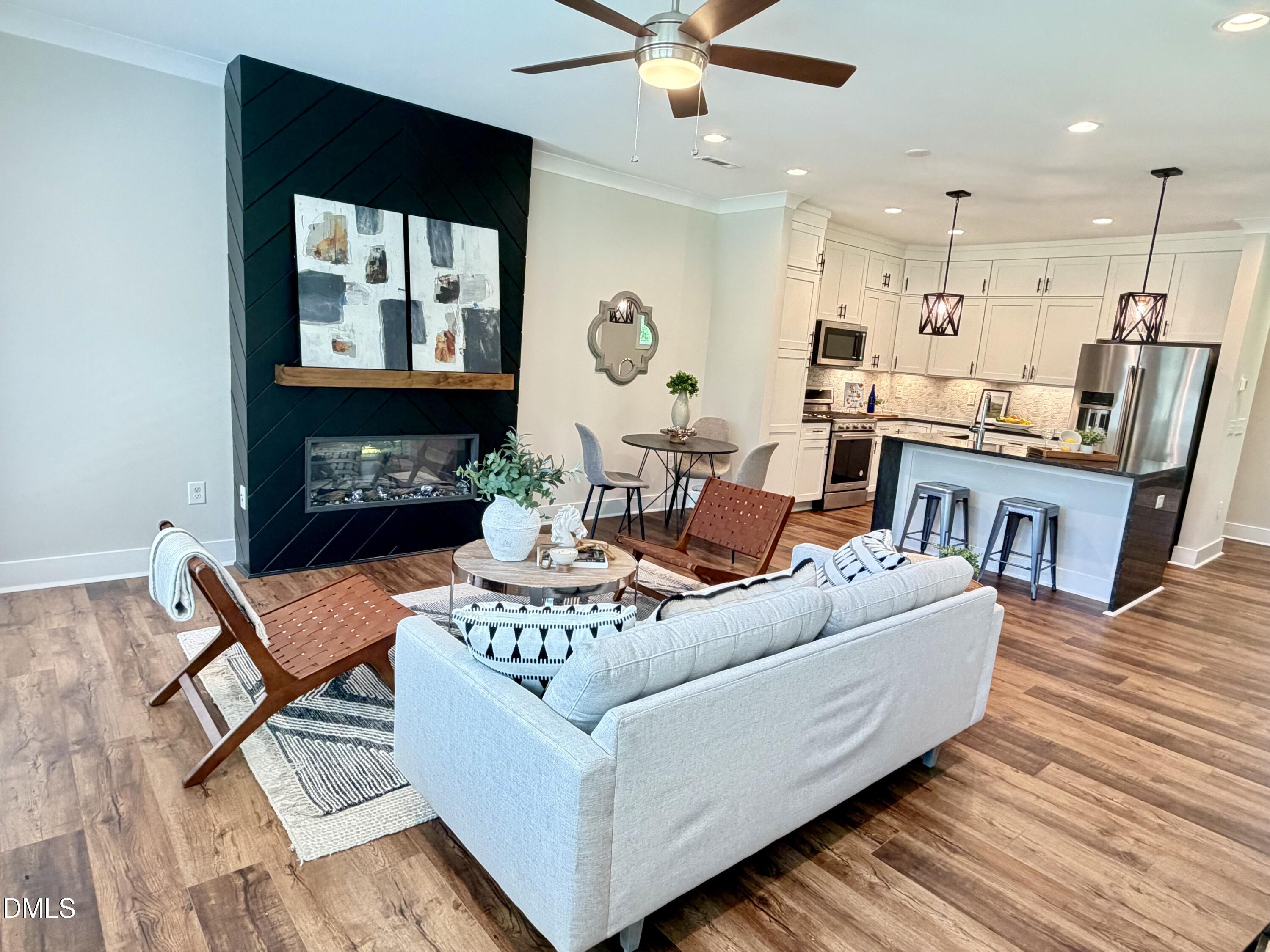4016 Emerald Green Road Raleigh, NC 27612 - Photo 5 of 22 a living room with furniture and a fireplace