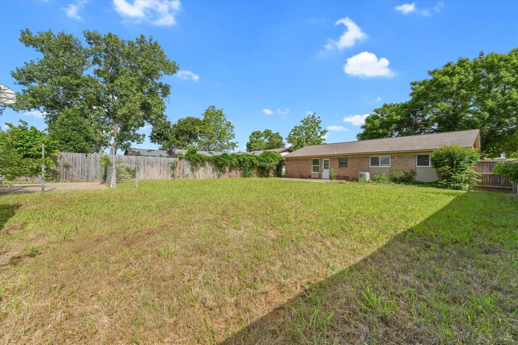 304 East Stone Road Wylie, TX 75098 - Photo 17 of 19 a house view with swimming pool and garden space