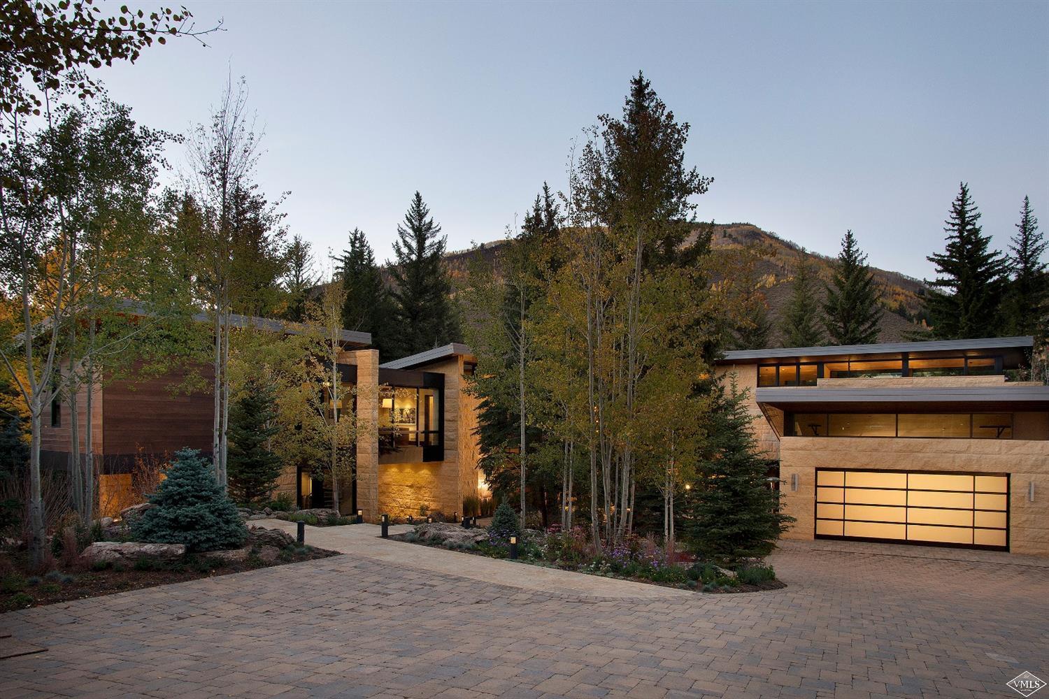 333 Beaver Dam Road Vail, CO 81657 - Photo 1 of 1 a view of a house with a yard and garage