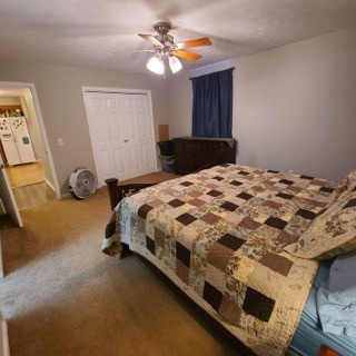 1749 Carney Winters Road Ashland City, TN 37015 - Photo 12 of 27 a bedroom with a bed and a chandelier