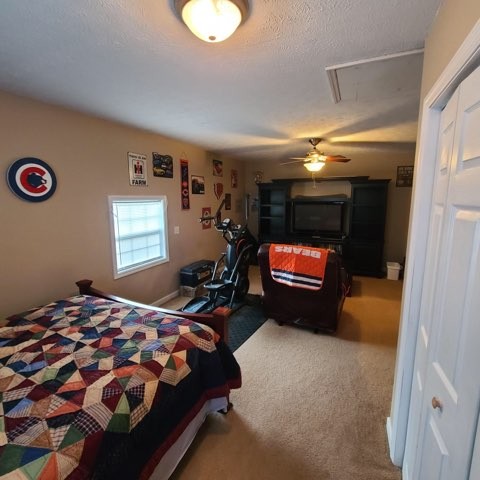 1749 Carney Winters Road Ashland City, TN 37015 - Photo 16 of 27 a bedroom with a bed and a chandelier