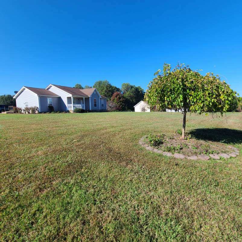 1749 Carney Winters Road Ashland City, TN 37015 - Photo 25 of 27 a view of a large garden with a small yard and large trees