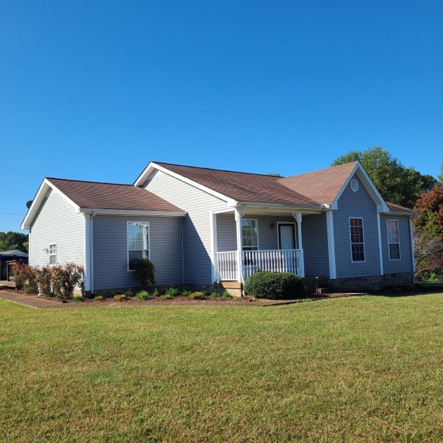 1749 Carney Winters Road Ashland City, TN 37015 - Photo 26 of 27 a view of a yard in front of a house with plants and large tree