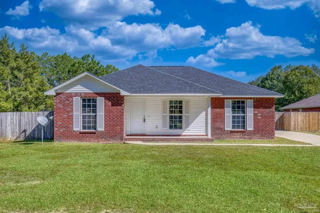 front view of a house with a yard