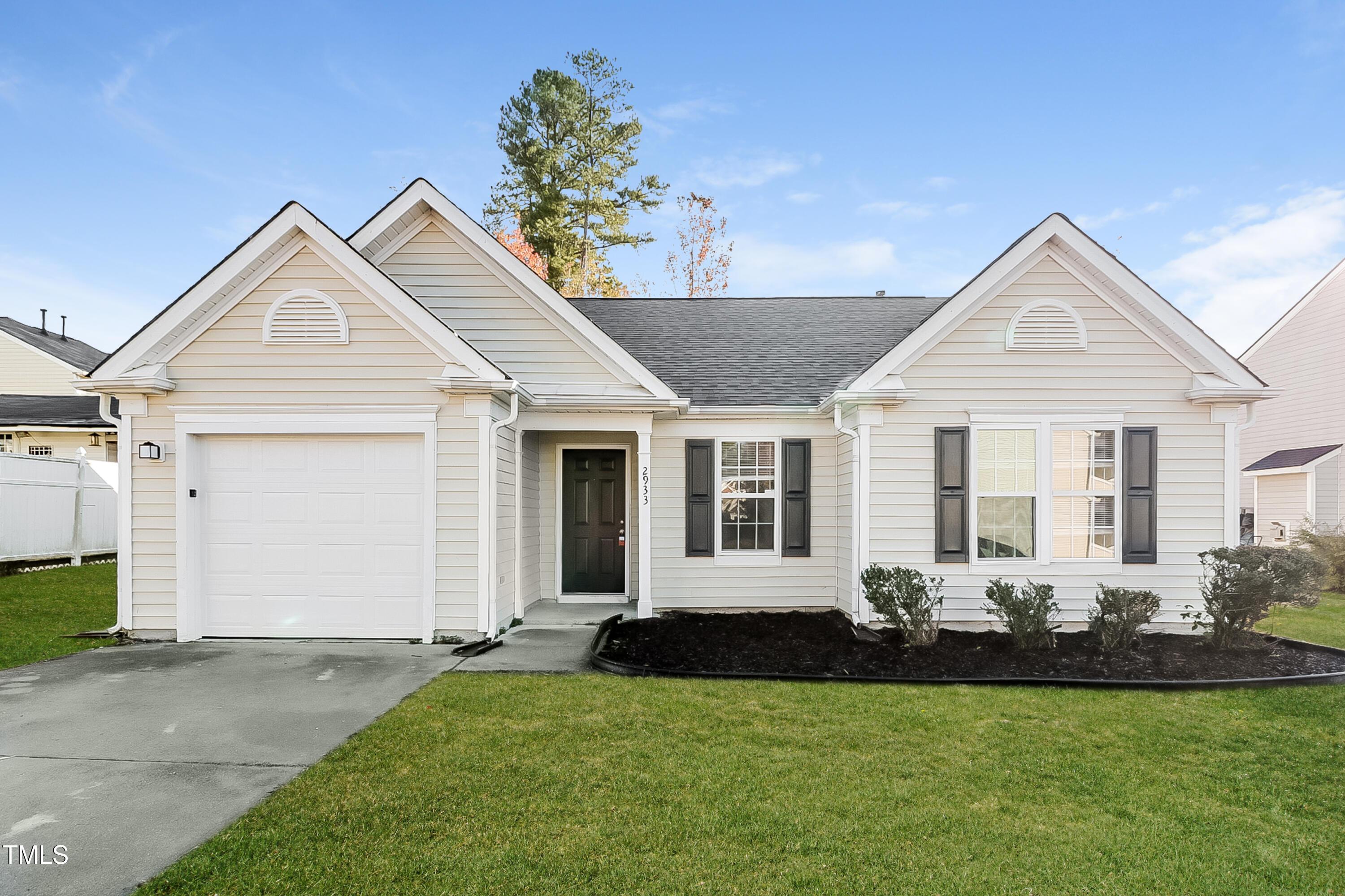 2933 Trassacks Drive Raleigh, NC 27610 - Photo 1 of 17 a front view of a house with a yard