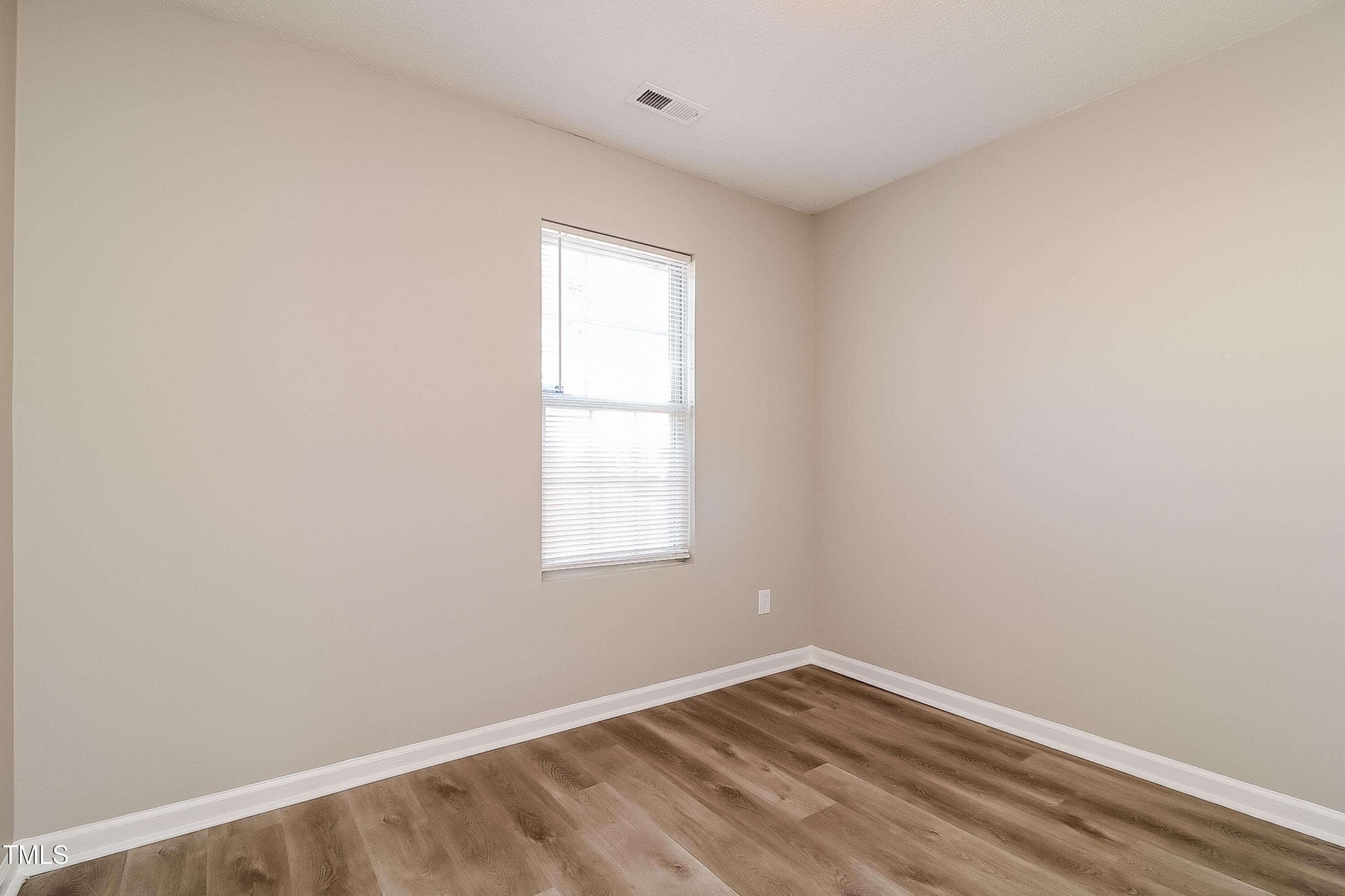 2933 Trassacks Drive Raleigh, NC 27610 - Photo 12 of 17 an empty room with a window