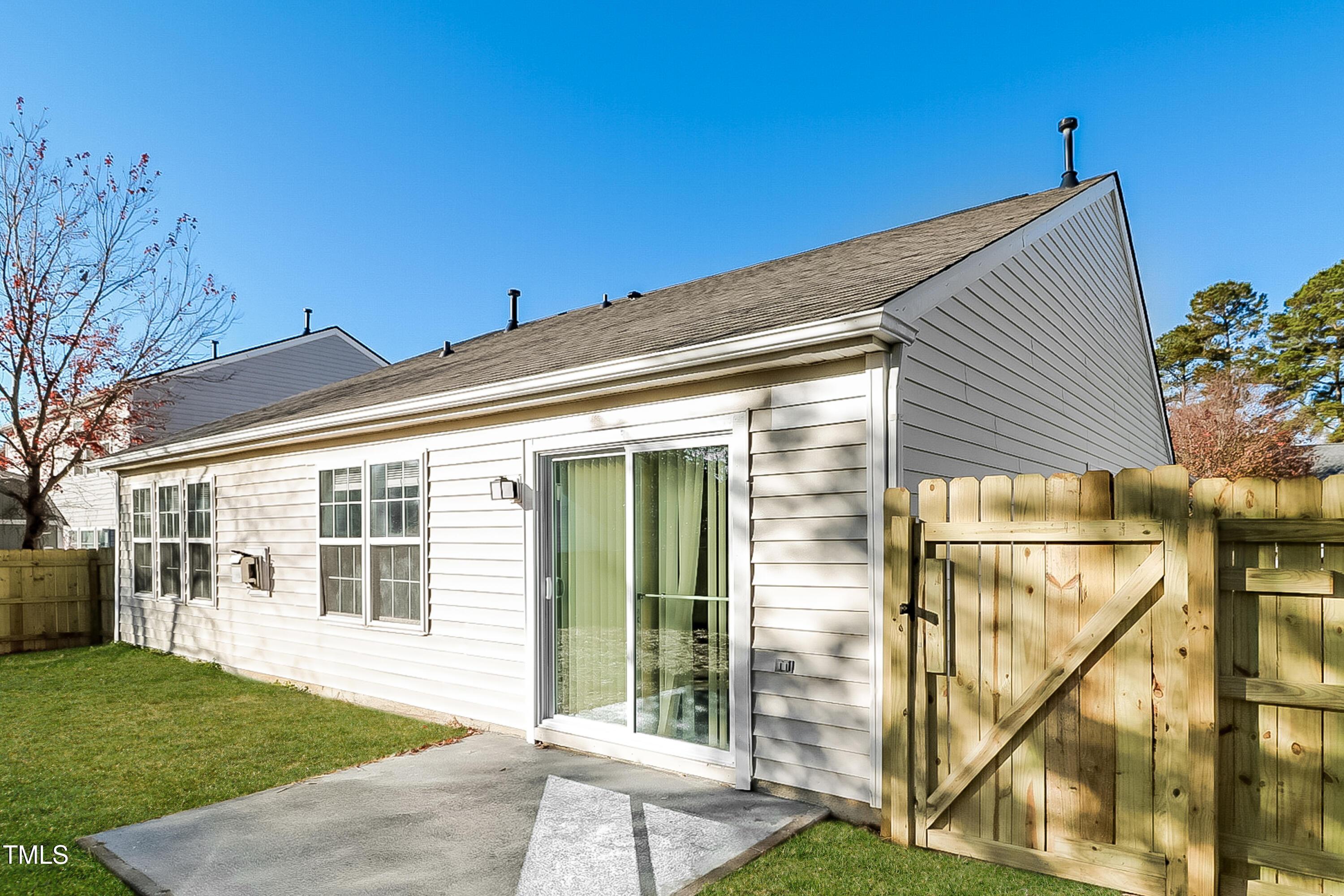 2933 Trassacks Drive Raleigh, NC 27610 - Photo 16 of 17 a view of a house with a backyard