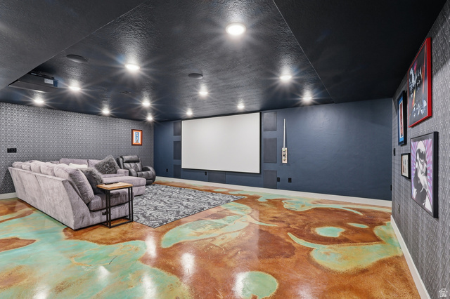 175 North 100 West Providence, UT 84332 - Photo 24 of 45 Home theater featuring wallpapered walls, finished concrete flooring, and a textured ceiling