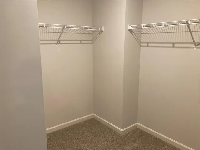 a view of a room with racks on the wall