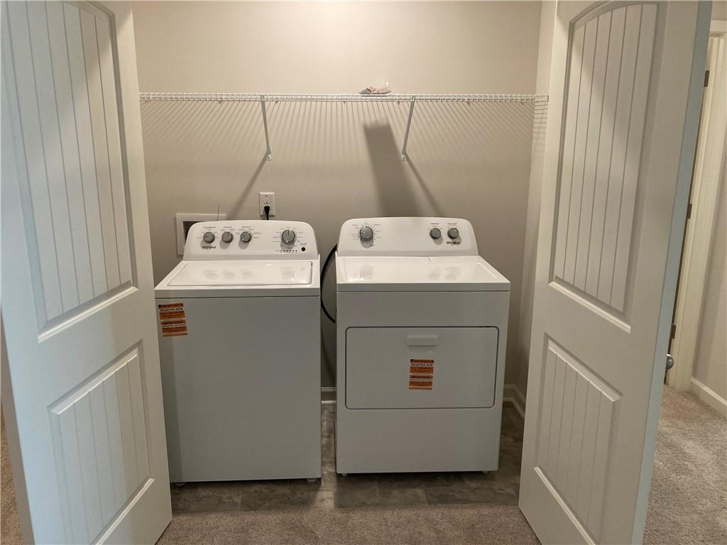 28 Rustin Ridge Dahlonega, GA 30533 - Photo 18 of 23 a utility room with dryer and washer