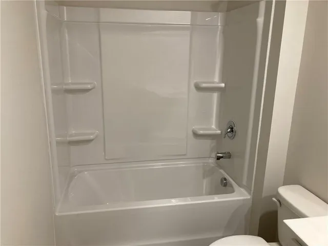 a bathroom with a bath tub