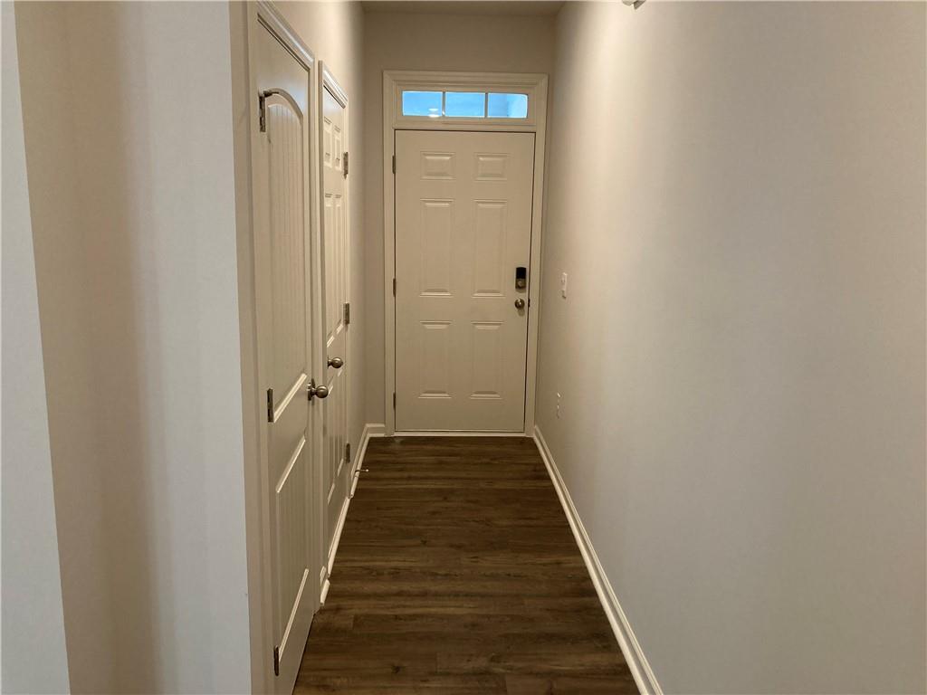 28 Rustin Ridge Dahlonega, GA 30533 - Photo 2 of 23 a view of a hallway with wooden floor and a glass door