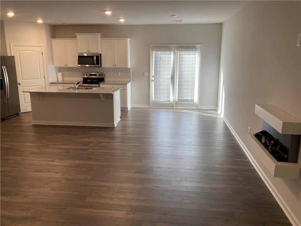 28 Rustin Ridge Dahlonega, GA 30533 - Photo 3 of 23 a kitchen with stainless steel appliances a refrigerator sink and microwave
