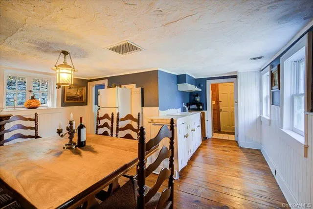 a very nice looking room with kitchen view and a large window