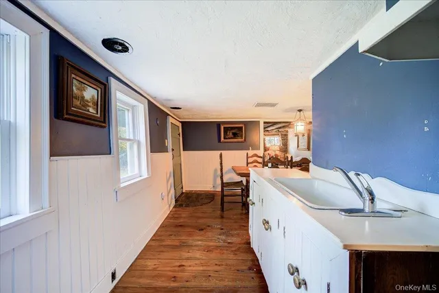 a kitchen with a sink and cabinets