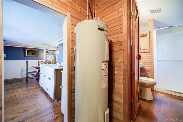 a kitchen with a refrigerator and a sink