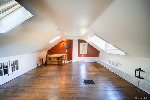 a view of an entryway with wooden floor
