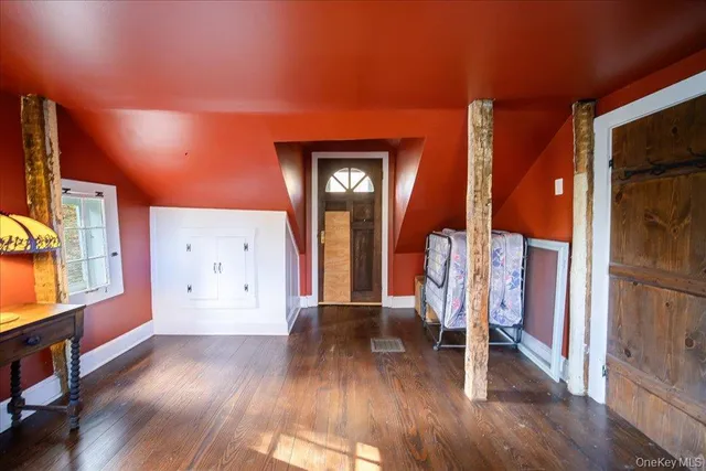 a view of an entryway with wooden floor