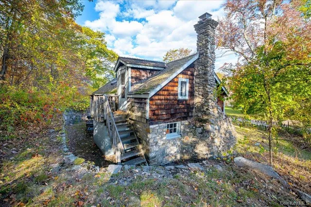 a aerial view of a house with a yard