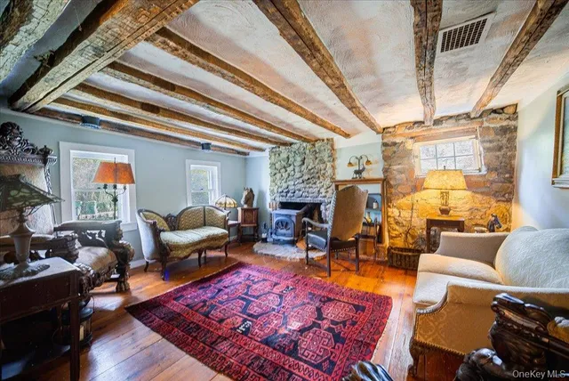 a living room with furniture a rug and a chandelier