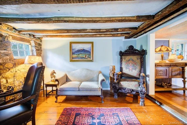 a living room with furniture and a rug