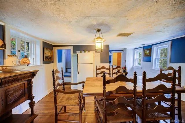 a view of a livingroom with furniture and a window