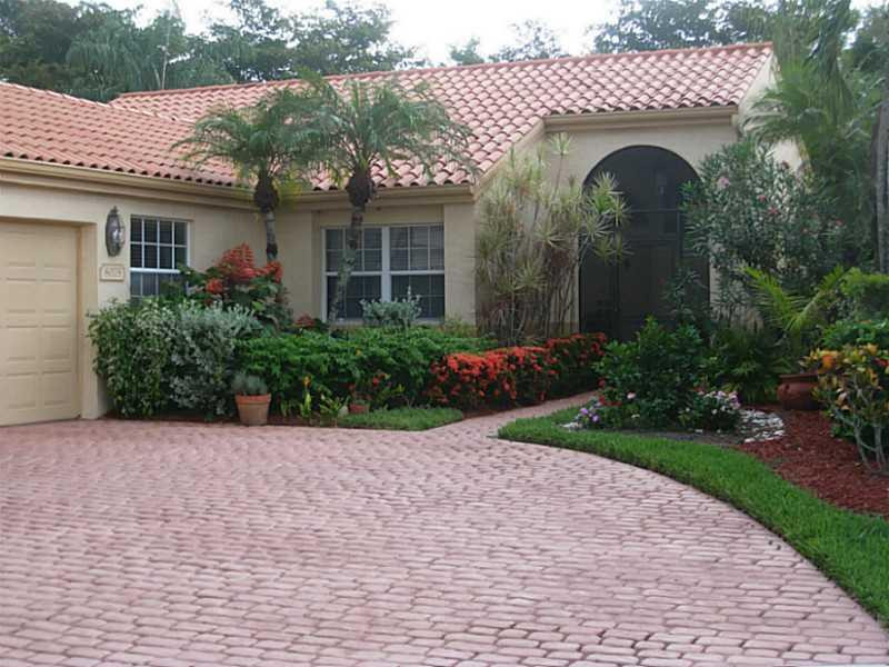 8075 Copenhagen Way Boca Raton, FL 33434 - Photo 1 of 24 a front view of a house with garden