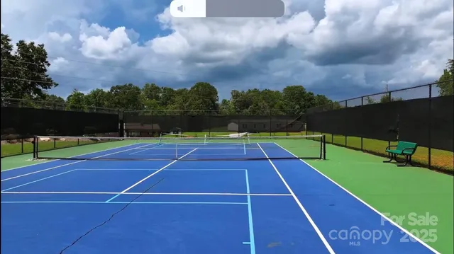 an aerial view of a house with a garden and swimming pool