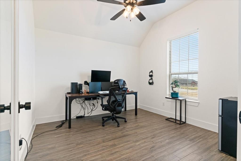 3021 Westfork Way Springtown, TX 76082 - Photo 13 of 35 a view of a workspace with furniture and a window