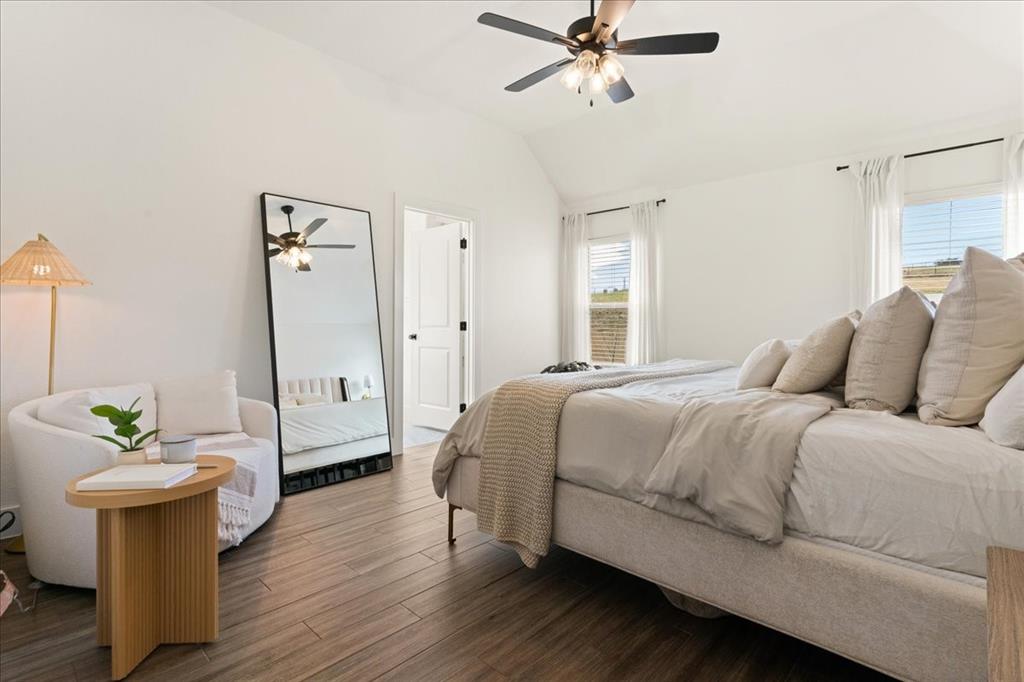 3021 Westfork Way Springtown, TX 76082 - Photo 20 of 35 a bedroom with a bed and wooden floor