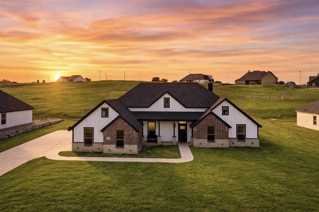 3021 Westfork Way Springtown, TX 76082 - Photo 2 of 35 a front view of a house with a yard