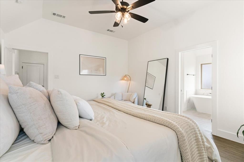 3021 Westfork Way Springtown, TX 76082 - Photo 21 of 35 a bedroom with a bed and a mirror