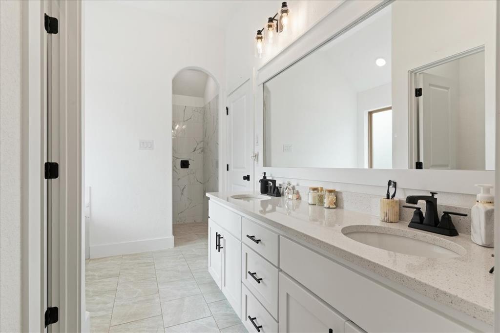 3021 Westfork Way Springtown, TX 76082 - Photo 23 of 35 a bathroom with a double vanity sink mirror and