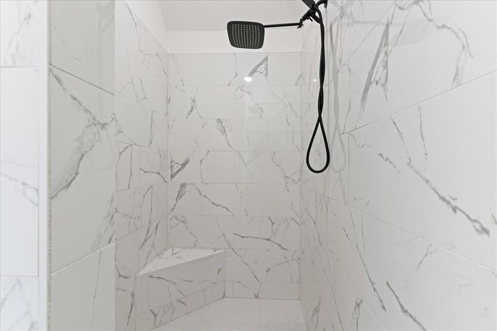 3021 Westfork Way Springtown, TX 76082 - Photo 24 of 35 a bathroom with a glass shower door