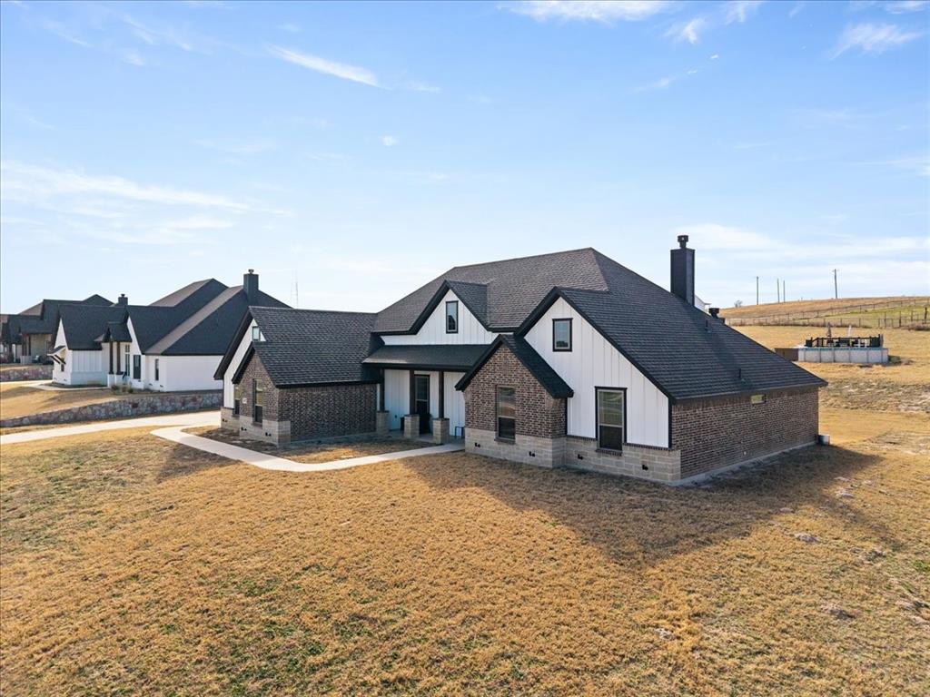 3021 Westfork Way Springtown, TX 76082 - Photo 26 of 35 a view of a house with a yard