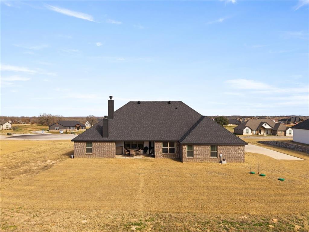 3021 Westfork Way Springtown, TX 76082 - Photo 28 of 35 a front view of house with ocean view