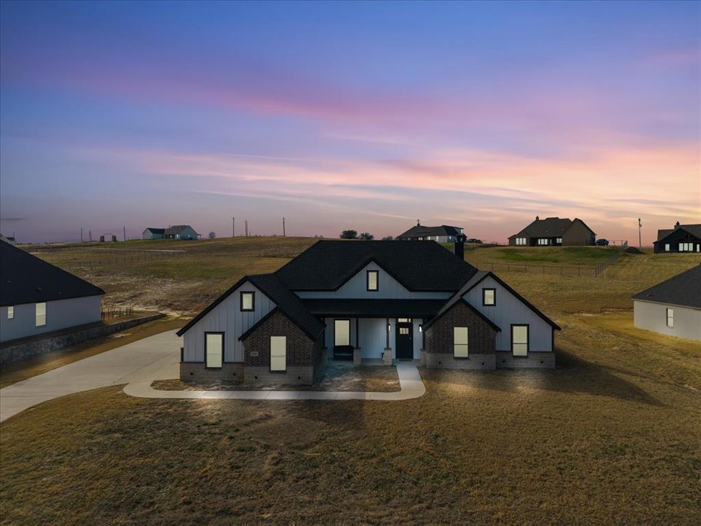 3021 Westfork Way Springtown, TX 76082 - Photo 29 of 35 a front view of a house with a yard