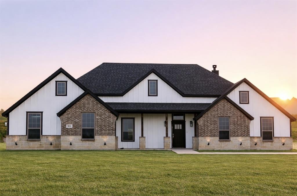 3021 Westfork Way Springtown, TX 76082 - Photo 34 of 35 a front view of a house with a garden and yard