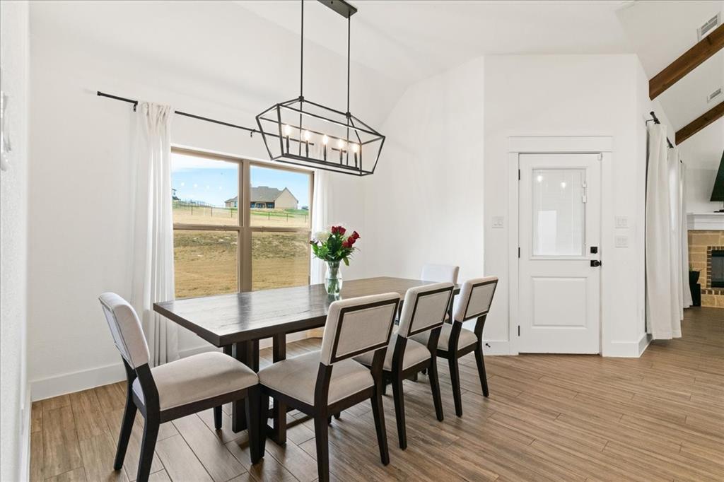 3021 Westfork Way Springtown, TX 76082 - Photo 8 of 35 a view of a dining room with furniture window and wooden floor